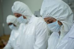 people wear masks in cleanroom