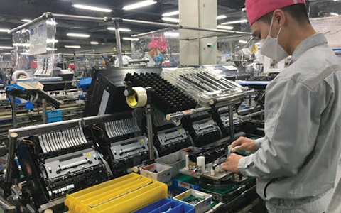 Man Wearing a Face Mask Working at a Factory 1